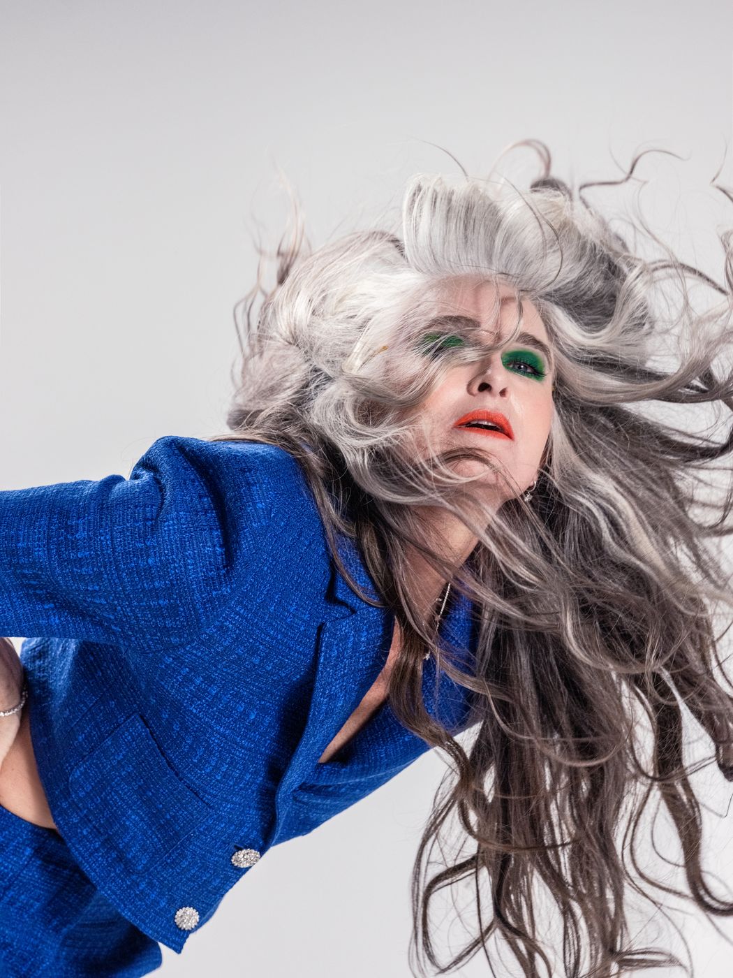 Editorial silver-haired hair styling in motion