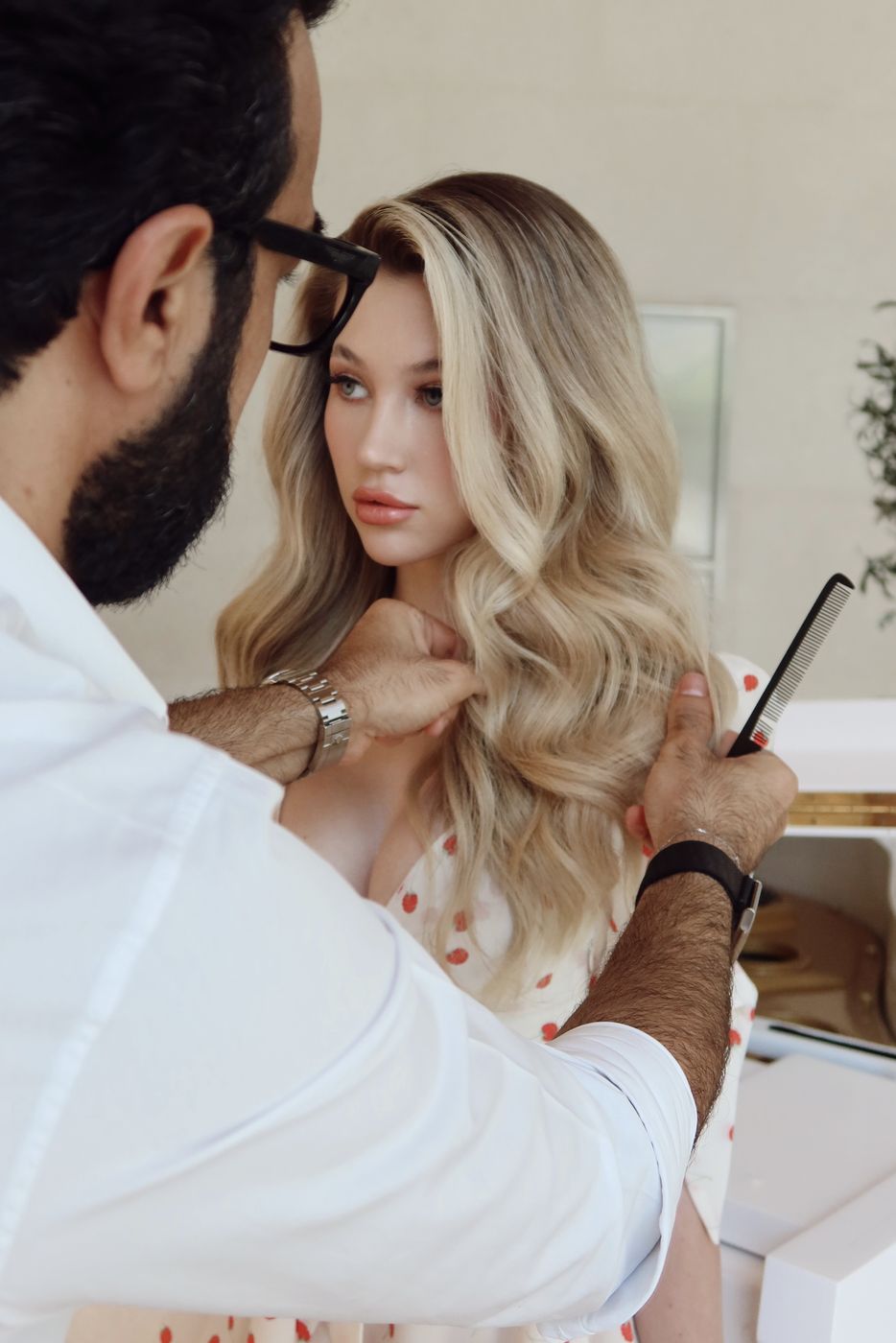 Laurance styling a client at the chair