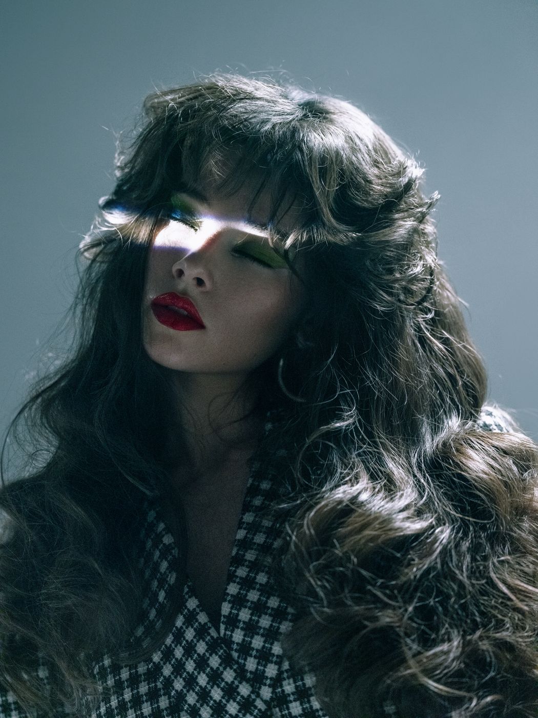 Moody editorial waves with a bold red lip
